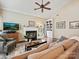 Cozy living room boasts a fireplace, a built-in bookcase, and natural light at 2516 Middlebridge Ln, Charlotte, NC 28270