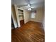 Cozy bedroom featuring hardwood floors, built-in shelving and natural light at 3253 Centergrove Rd, Kannapolis, NC 28083