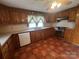 Traditional kitchen features wood cabinets, tile floor and stainless-steel appliances at 3253 Centergrove Rd, Kannapolis, NC 28083