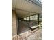Long covered porch with swing and weathered wood at 3253 Centergrove Rd, Kannapolis, NC 28083