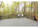 Inviting gray back deck with forest views at 3505 Mayspring Pl, Charlotte, NC 28269