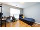 Bedroom with hardwood floors and a desk with shelving at 3505 Mayspring Pl, Charlotte, NC 28269