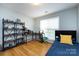 Comfortable bedroom with hardwood floors and shelving at 3505 Mayspring Pl, Charlotte, NC 28269