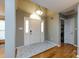 Bright foyer with arched doorway, tile rug and light fixture at 3505 Mayspring Pl, Charlotte, NC 28269