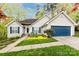 Charming single-story home with a well-maintained lawn, blue shutters, and attached garage on a sunny day at 3505 Mayspring Pl, Charlotte, NC 28269
