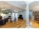 Open living room featuring a fireplace, high ceilings, hardwood floors, and a neutral color palette at 3505 Mayspring Pl, Charlotte, NC 28269