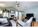 Living room featuring a fireplace, high ceilings, hardwood floors, and a neutral color palette at 3505 Mayspring Pl, Charlotte, NC 28269
