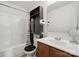 Cozy bathroom with a shower-tub and functional storage shelves for organization at 3944 Hemingway Nw Dr, Hickory, NC 28601