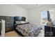 Modern bedroom with a large bed, stylish dresser, and plenty of natural light at 3944 Hemingway Nw Dr, Hickory, NC 28601