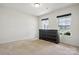 Bright, carpeted bedroom with natural light and a dark wood dresser at 3944 Hemingway Nw Dr, Hickory, NC 28601