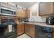 Functional kitchen featuring modern appliances, tile backsplash, and ample cabinet space at 3944 Hemingway Nw Dr, Hickory, NC 28601