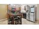 Well-equipped kitchen with stainless steel appliances and a breakfast table at 3944 Hemingway Nw Dr, Hickory, NC 28601