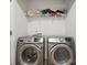 Convenient laundry room with a large washer and dryer set, and shelving for organized storage in a modern home at 3944 Hemingway Nw Dr, Hickory, NC 28601