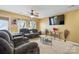 Comfortable living room featuring neutral tones, a ceiling fan, and modern furnishings at 3944 Hemingway Nw Dr, Hickory, NC 28601