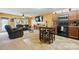 Open-concept living area with a dining table, ceiling fan, and large television at 3944 Hemingway Nw Dr, Hickory, NC 28601