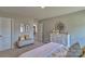 Bright carpeted bedroom with neutral walls, a full dresser, and a decorative mirror at 4025 Cramer Estates Ct, Gastonia, NC 28056