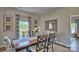 Elegant dining area with a wooden table, patterned chairs, and stylish decor at 4025 Cramer Estates Ct, Gastonia, NC 28056