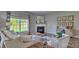 Inviting living room with a fireplace, comfortable seating, and natural light at 4025 Cramer Estates Ct, Gastonia, NC 28056
