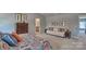 Inviting main bedroom featuring a comfortable sitting area, large windows, and tasteful decor at 4025 Cramer Estates Ct, Gastonia, NC 28056