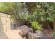 Cozy backyard featuring a patio, wooden fence, a shed and lush greenery for serene outdoor living at 4607 Hedgemore Dr # D, Charlotte, NC 28209
