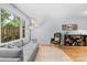 Bright and airy living room featuring a large window, comfortable seating and hardwood floors at 4607 Hedgemore Dr # D, Charlotte, NC 28209