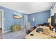 Home office with light blue walls, desk setup, vintage trunk, decorative rug enhancing its appeal at 4607 Hedgemore Dr # D, Charlotte, NC 28209