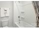 Bathroom with a bathtub and shower combination with white tile and chrome hardware at 4610 Harris Elliot Rd, Lincolnton, NC 28092