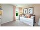 Bedroom with a daybed dressed with decorative pillows, next to a window with an outside view at 4610 Harris Elliot Rd, Lincolnton, NC 28092