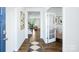 Inviting foyer with hardwood floors, a stylish area rug, and a view of the living room and office at 4610 Harris Elliot Rd, Lincolnton, NC 28092