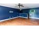 The basement features wood flooring and blue walls at 5015 Drake Pond Ln, Rock Hill, SC 29732