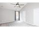 Neutral bedroom featuring a ceiling fan, window with curtains and a gray carpet at 5015 Drake Pond Ln, Rock Hill, SC 29732