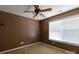 Bedroom with a fan and bright natural light through the window at 5015 Drake Pond Ln, Rock Hill, SC 29732