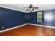 This bedroom features wood flooring, shelving and a window at 5015 Drake Pond Ln, Rock Hill, SC 29732
