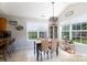 Cozy dining area with natural light, perfect for Gathering meals and entertaining guests with backyard views at 5015 Drake Pond Ln, Rock Hill, SC 29732