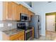 Close-up of stainless steel appliances and beautiful countertops in kitchen at 5015 Drake Pond Ln, Rock Hill, SC 29732