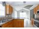 Kitchen with bar seating features stainless steel appliances and ample storage at 5015 Drake Pond Ln, Rock Hill, SC 29732