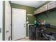 Functional laundry room with modern washer, dryer, and ample storage shelves at 5015 Drake Pond Ln, Rock Hill, SC 29732