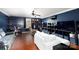 A versatile living room offers a comfortable lounging area, media setup, and functional workspace with ample storage at 5015 Drake Pond Ln, Rock Hill, SC 29732