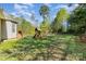 Large backyard with wooden fence, play set and abundant green space at 5108 Boardwalk Ct, Dallas, NC 28034