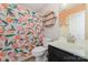 Charming bathroom with a peach-themed shower curtain and unique circular shelving at 5108 Boardwalk Ct, Dallas, NC 28034