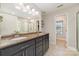Bathroom with dual sink vanity, granite countertop, and large mirror at 5108 Boardwalk Ct, Dallas, NC 28034