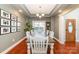 Elegant dining room featuring hardwood floors, coffered ceilings and an arched entryway at 5108 Boardwalk Ct, Dallas, NC 28034