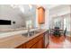 Kitchen bar top featuring granite countertops and stainless sink at 5108 Boardwalk Ct, Dallas, NC 28034