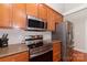 Close up of modern kitchen with stainless steel appliances and granite countertops at 5108 Boardwalk Ct, Dallas, NC 28034