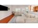 Bright living room features a sectional couch, wood floors, skylights, and an open layout at 5108 Boardwalk Ct, Dallas, NC 28034