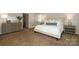 Bright bedroom with neutral tones, providing a calm and relaxing atmosphere for rest and rejuvenation at 6910 Green Turtle Dr, Charlotte, NC 28210
