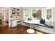 Bright breakfast nook with a cozy built-in bench and a charming marble-top table at 6910 Green Turtle Dr, Charlotte, NC 28210