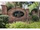 The Johnston Hall community is marked with a brick entrance and a black sign at 6910 Green Turtle Dr, Charlotte, NC 28210