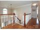 Upstairs foyer showcasing hardwood floors, staircase, and lots of natural light at 6910 Green Turtle Dr, Charlotte, NC 28210