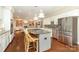 Open kitchen with stainless steel appliances, island, and view to the living room at 6910 Green Turtle Dr, Charlotte, NC 28210
